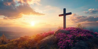 Cross adorned with flowers at sunrise on a mountain, symbolizing hope and serenity photo