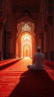 Sunrise meditation in a grand mosque with ornate architecture and warm light illuminating the hall photo