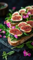 Delicious fig and arugula toast garnished with vibrant flowers served on a rustic stone surface photo