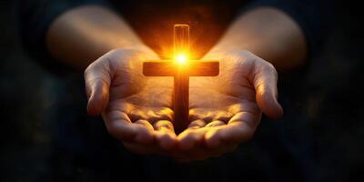 Illuminated cross held by hands symbolizes faith and hope during a spiritual moment at dusk photo