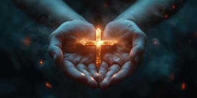 Hands holding a glowing cross in a dark atmosphere during a spiritual moment of reflection and faith expression photo
