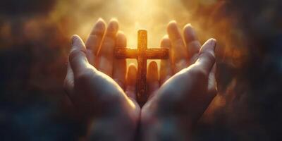 Hands hold a wooden cross illuminated by a warm glow in a spiritual moment of reflection and devotion outdoors photo