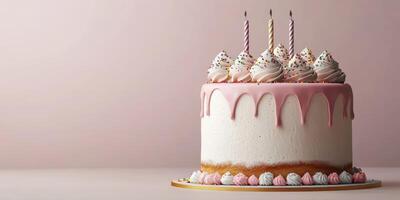 Delicious pink and white cake adorned with whipped cream, sprinkles, and candles on display for a special celebration photo