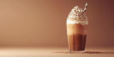 Creamy iced coffee topped with whipped cream and chocolate served in a tall glass on a smooth surface photo