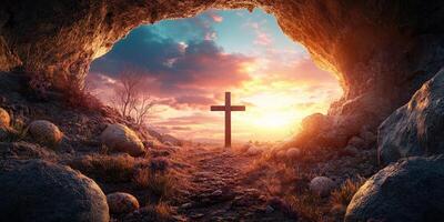 Sunset view from a cave with a cross at the entrance, showcasing serene landscape and colorful sky photo