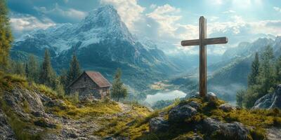 Mountain landscape featuring a wooden cross near a cabin reflected in a serene lake under a cloudy sky photo