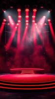 Stage illuminated with red lights creates an atmospheric setting for a performance in an indoor venue photo