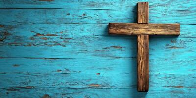 Wooden cross placed on a vibrant blue wooden background showcasing faith and craftsmanship photo