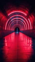 Bright red neon lights illuminate a modern tunnel in an urban setting at night photo