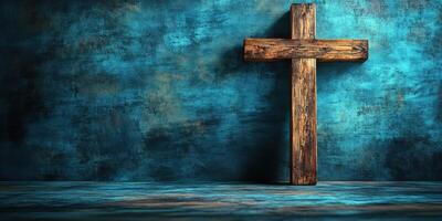 Wooden cross against a textured blue wall in a calm and serene setting for reflection and contemplation photo