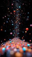 Colorful spheres cascade in a dynamic pattern against a dark background, creating a sense of motion and depth photo