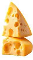 Delicious yellow cheese stacked on top of each other showcasing its texture and holes in a bright light setting photo