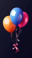 Colorful balloons with ribbons arranged beautifully against a dark background for celebration photo