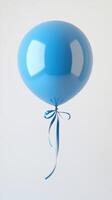 Bright blue balloon tied with ribbon floats against a neutral background, perfect for celebrations and decorations photo