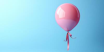 Colorful pink balloon floating against a light blue background creates a cheerful and festive atmosphere for celebrations photo