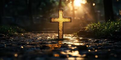 Glowing cross in a serene natural setting during golden hour with sunlight filtering through trees photo