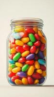 Colorful candy jar filled with vibrant jelly beans showcasing various shades and textures on bright background photo