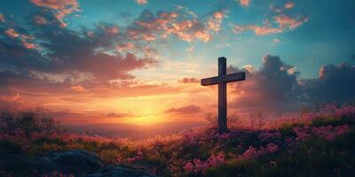 Cross stands in a field of flowers at sunset with vibrant clouds and warm colors photo