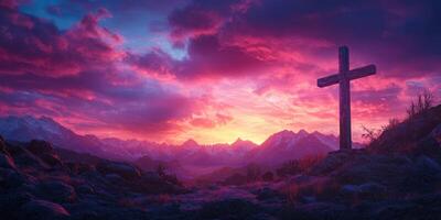 Majestic sunset over mountain landscape with wooden cross standing in silhouette photo