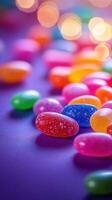 Colorful jelly beans scattered on a purple surface with soft bokeh lights in a festive atmosphere photo
