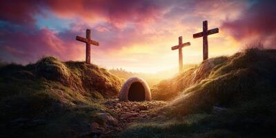 Sunset over three crosses near a stone tomb on a grassy hilltop, symbolizing hope and renewal photo