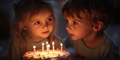 Children celebrate a birthday with cake and candles in a warm, dimly lit room during an evening gathering photo
