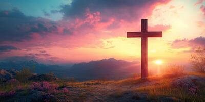 Sunrise over mountains with a wooden cross framed by colorful clouds and blooming flowers photo