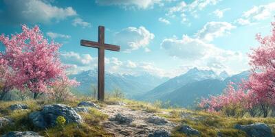 Wooden cross stands amidst blooming cherry trees and majestic mountains on a clear spring day photo