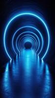 Glowing blue tunnel with illuminated circular patterns in a dark space creating a surreal atmosphere photo