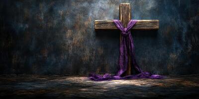 Cross wrapped in purple fabric against textured background highlighting religious symbolism and spirituality photo