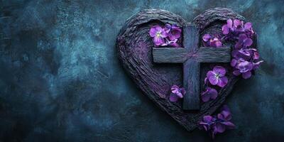 Heart-shaped wooden cross adorned with purple flowers on a textured blue background photo