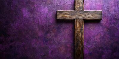 Wooden cross on a textured purple background during a religious ceremony photo