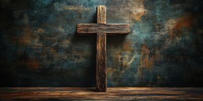Wooden cross displayed against an aged, textured background with muted colors and visible grain patterns photo