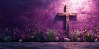 Rustic wooden cross against a vibrant purple wall surrounded by lush greenery photo
