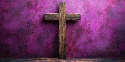 Wooden cross against a vibrant purple wall in a serene setting photo