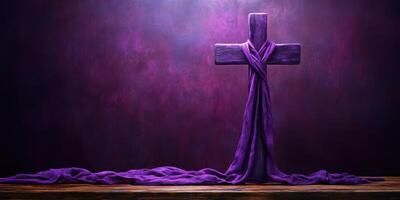 Purple cross adorned with fabric resting on rustic wooden table in a softly lit room photo