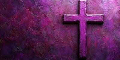 Purple cross on textured wall symbolizes faith and spirituality in a serene setting photo