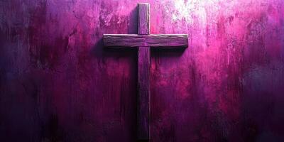 Illuminated wooden cross against a vibrant purple textured wall during evening light photo