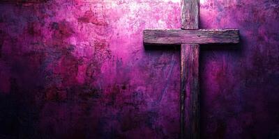 Wooden cross against a vibrant purple wall creating a striking contrast and a sense of spirituality photo