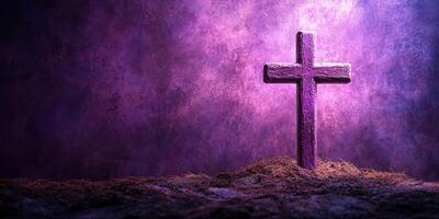 A wooden cross stands on a bed of moss under purple lighting in a serene and contemplative setting during twilight hours photo