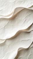 Textured white paper with wavy folds creates an artistic background for design projects or crafts photo