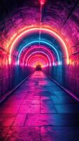 Colorful neon lights illuminate a dark tunnel creating a mesmerizing visual effect at night photo