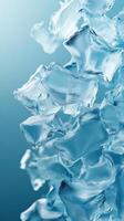 Floating ice cubes create an abstract composition against a blue backdrop photo