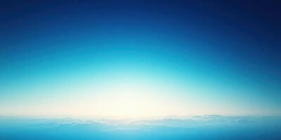Sunrise over calm ocean landscape with vibrant blue sky and soft clouds photo