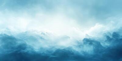 Cloudy sky with soft blue hues illuminating the horizon during early morning light photo