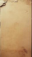 Brown cardboard box with rough edges and a worn appearance in a minimalist setting photo