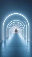 Illuminated tunnel with arching lights creates a modern architectural space for exploration and creativity photo