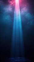 Bright beams of light emerge from dark clouds in a serene night sky illuminating the tranquil atmosphere photo
