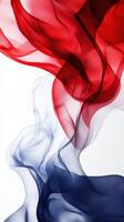 Colorful flowing fabric creates vibrant waves in red, white, and blue against a white background photo