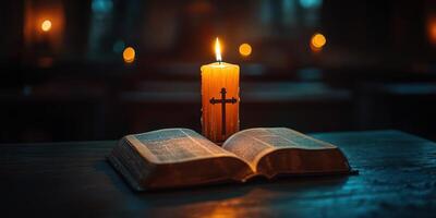 Soft candlelight illuminates an open book with a cross symbol on the table in a quiet setting, creating a peaceful atmosphere for reflection photo